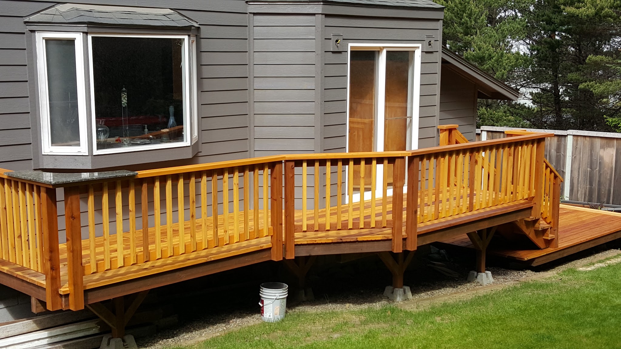 A freshly rebuilt cedar deck and re-sided home in Newport, Oregon