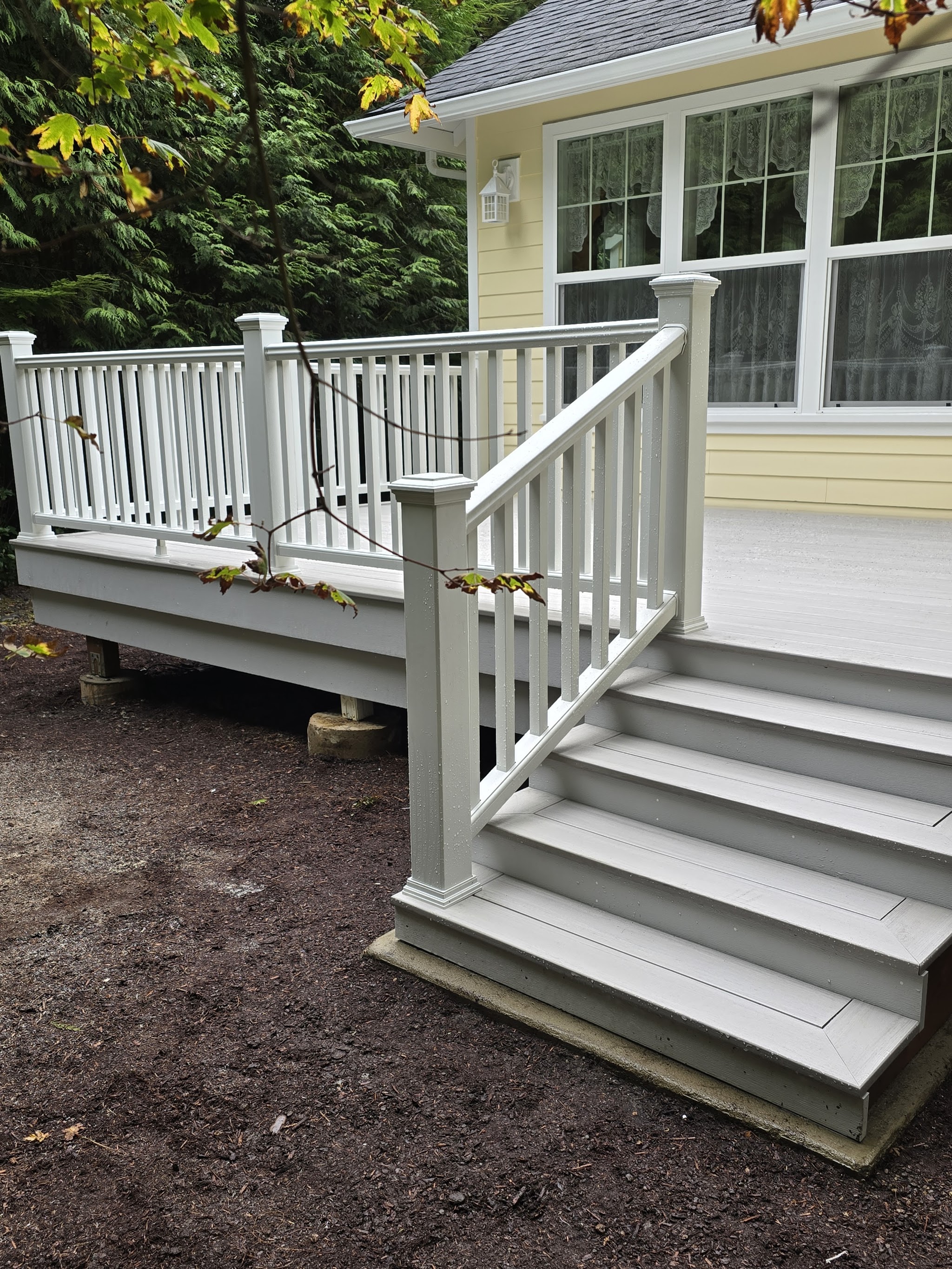 Finished white-railed deck with stairs